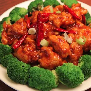 a plate of broccoli and chicken