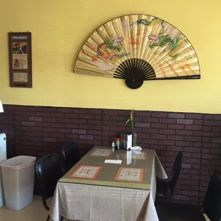 a dining room with a table and chairs