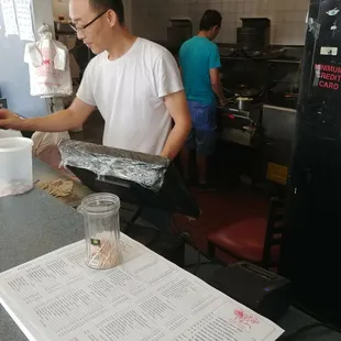 a man preparing food in a kitchen