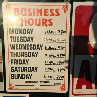 a business hours and hours sign