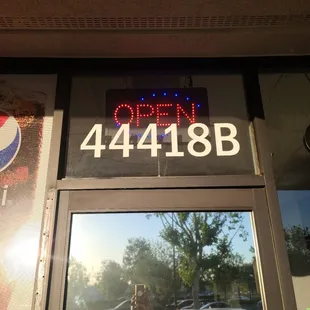 the open sign in the window