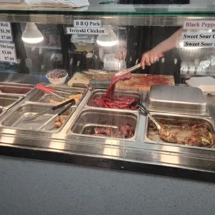 a buffet with a variety of food items