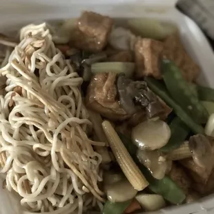 noodles and meat in a takeout container