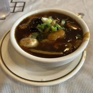 a bowl of soup on a plate