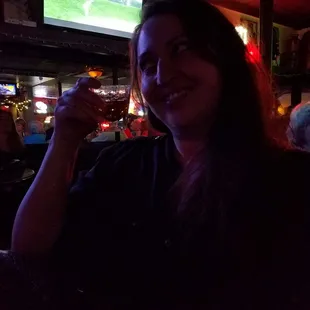 a woman holding a glass of wine