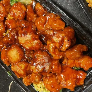a tray of chicken and broccoli