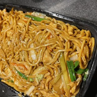 noodles in a black container