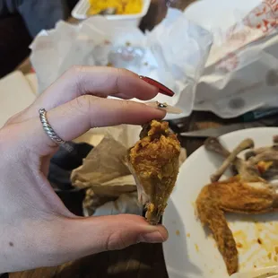a hand holding a piece of food
