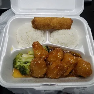 Egg roll, sesame chicken, and white rice.