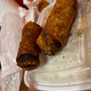 a hot dog wrapped in sesame sticks