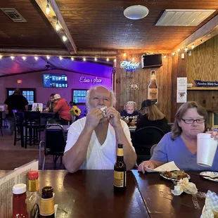 a man and a woman eating food