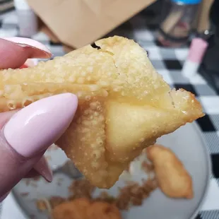 &quot;Crab Rangoon&quot; . Maybe a quarter tablespoon of cream cheese and absolutely no crab wrapped up in a fried wonton. Don&apos;t waste your money