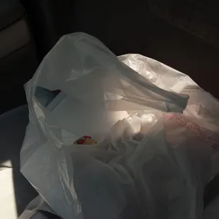 a plastic bag in the back seat of a car