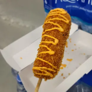 a hot dog on a stick