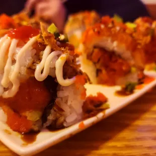 a close up of a dragon sushi