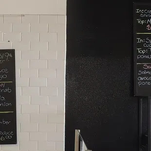 Menu boards posted on a wall