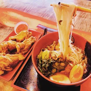 Noodles Your Way w rice noodles, tonkstsu broth, chicken, egg, mushrooms, bok choy, and nori w a side of wings