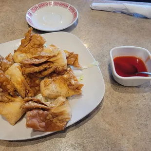 Crab rangoon with sweet and sour dipping sauce. Large sizes but didn&apos;t taste very good.