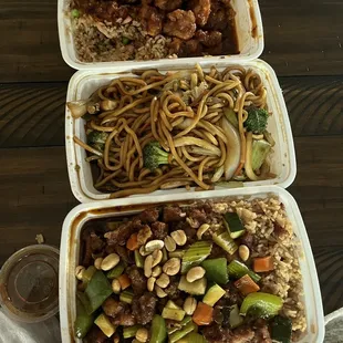 three containers of food on a table