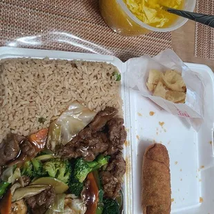 Beef with vegetables lunch with egg drop soup and egg roll