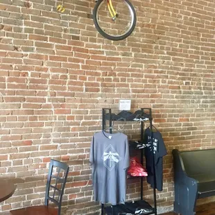 a bicycle hanging on a brick wall