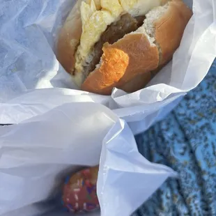 Bagel, Egg, Cheese with Sausage and pink sprinkle donut