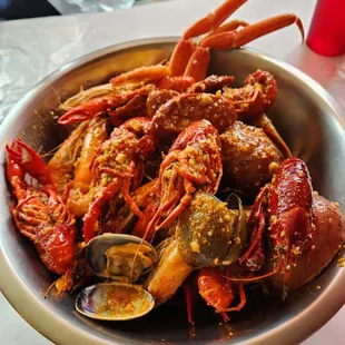 Half-combo special with garlic butter house sauce (shrimp, clams, crawfish, cluster of snow crab, potatoes, corn, sausage)