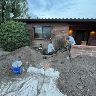 Digging under house to fix broken pipe