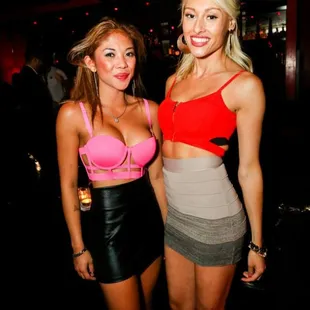 two beautiful women posing for the camera