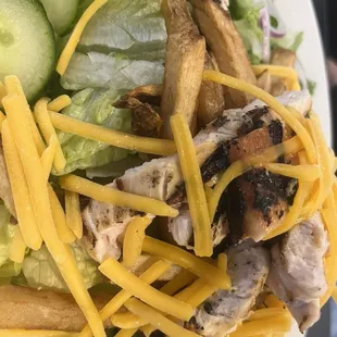 Grilled chicken salad with fries and Italian dressing