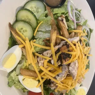 Grilled chicken salad with fries and Italian dressing