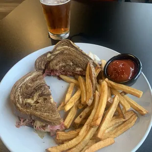 Reuben sandwich with fries.