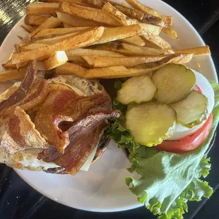 The Derrick burger with added egg and added bacon , side of fries