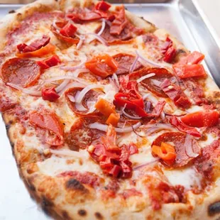 The '89 pizza, featuring spicy pepperoni, Calabrian chili, red and fresh mozzarella is one of our favorites.