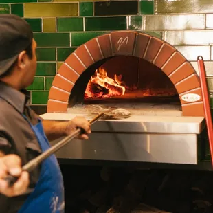 This thing fires at many hundreds of degrees and cooks those pies in under ten minutes.