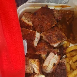 a plate of meat and french fries
