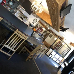 Looks like it used to be a sushi/Asian restaurant. Could turn the sushi bar into an old fashioned pastry cabinet