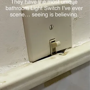 Seeing is believing... check out this uniquely creative Light Switch in the Men's Bathroom.