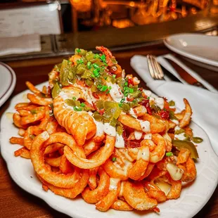 a plate of pasta with shrimp