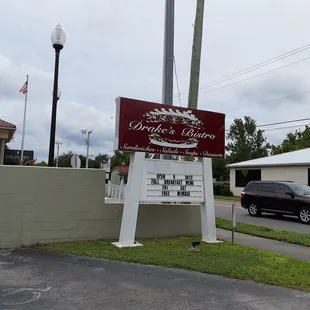 a sign in front of a restaurant