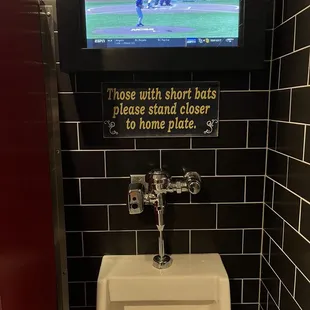 a urinal in a public restroom