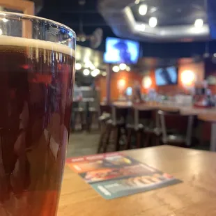 a pint of beer on a table