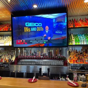 a bar with a large screen