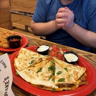 Quesadilla appetizer and side of tater tots