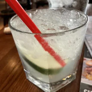 Cucumber cocktail. EFFEN cucumber vodka, sweet and sour mix, simple syrup, citrus soda, cucumber and lime.