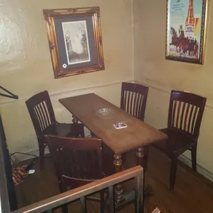 a wooden table and chairs
