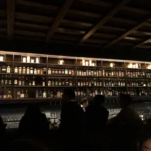 a bar filled with bottles of alcohol