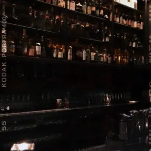 a bar with bottles of liquor