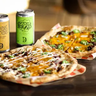 two pizzas and a can of soda