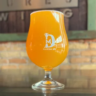 a glass of beer on a table